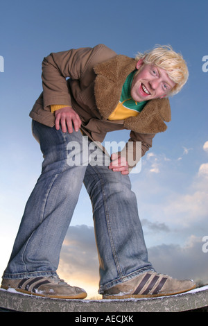 bending down young man Stock Photo