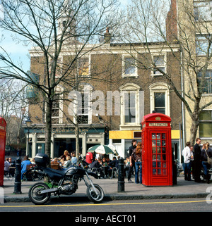 Red phone box by the Crown Tavern Clerkenwell Green London England UK Stock Photo