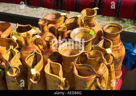 Colourful pottery vases and jugs for sale outside gift shop, Romania Stock Photo