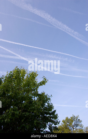 Vapour Trails in Sky from Aircraft Engines Pollution Environment Wales Stock Photo