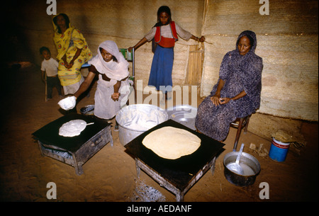 Sudan Women Preparing Food at Mwelhi Camp Stock Photo