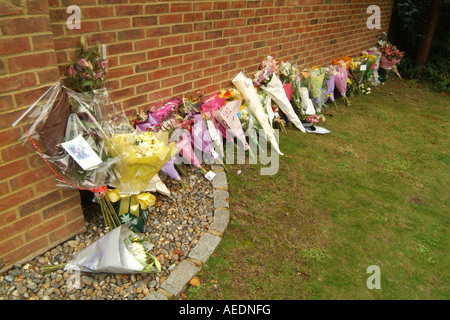 Floral tributes left by the road where a policeman was killed in an accident. Stock Photo