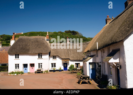 UK Devon Inner Hope thatched cottages in village square Stock Photo