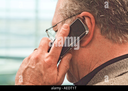 Businessman talking on cell phone Stock Photo
