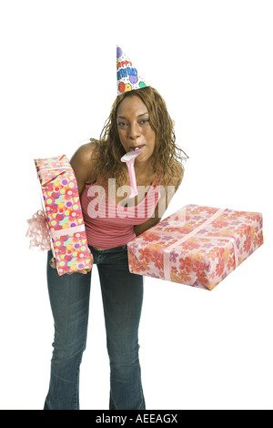 Young African American woman with whistle and soccer ball on green ...