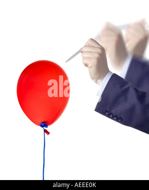 Burst red balloon and pin Stock Photo - Alamy