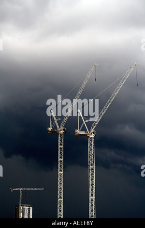 Cranes against a stormy sky, Salford Quays, Manchester, UK Stock Photo