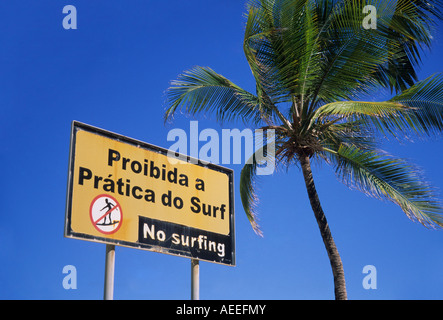 Bilingual Portuguese English sign saying No Surfing at Boa Viagem Beach Recife Pernambuco Brazil Stock Photo