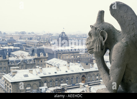One of the many gargoyles atop Notre Dame Cathedral in Paris France Stock Photo