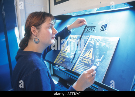 Female photographer at work in newspaper magazine in casual clothing Stock Photo