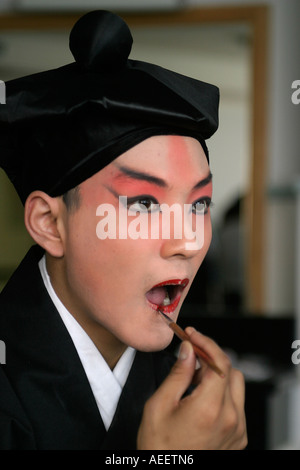 College students studying Bejing Classical Opera get made up for their performance at the Yifu Theatre Shanghai Stock Photo