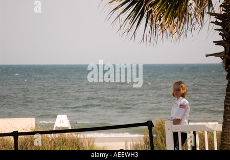 Caucasian Female Police Officer on the Beach Stock Photo