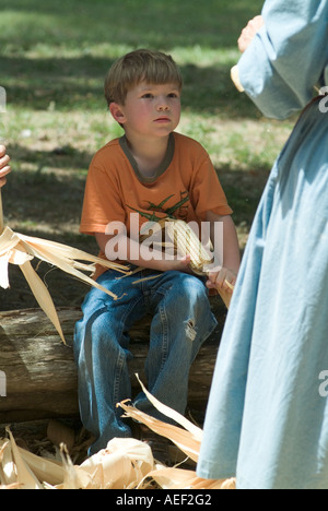 Dudley Farm Historic State Park living Florida historic site boy shucking corn MR history old Florida learning Stock Photo