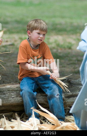 Dudley Farm Historic State Park living Florida historic site boy shucking corn MR history old Florida learning Stock Photo