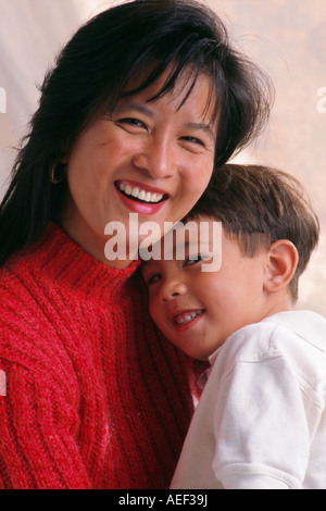 Filipina Mother and son 2-4 year old pre-k smiling portrait multi ethnic biracial ethnic diversity racial diverse cultural multicultural close up POV Stock Photo