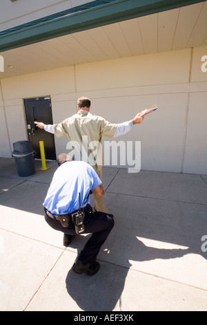 CO shaking down frisking inmate in the yard at maximum security prison ...