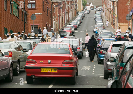 muslims gathering on the street after friday prayers on a street in Blackburn, Lancashire, UK Stock Photo