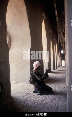 Mali Djenne, Man praying in Mosque Stock Photo