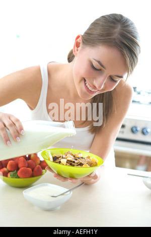 young woman eating cereal Stock Photo