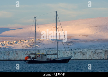 sailboat in glacial waters along the western Antarctic peninsula Antarctica Southern Ocean Stock Photo