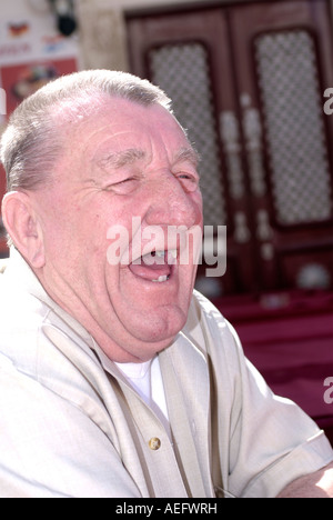 A old toothless man with mouth wide open as he laughs Stock Photo