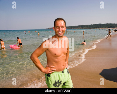 Smiling man on the beach Stock Photo