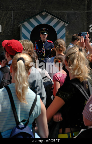 Czech schoolchildren watch castle guard standing firm at the main entrance to Prague Castle in Czech republic Stock Photo