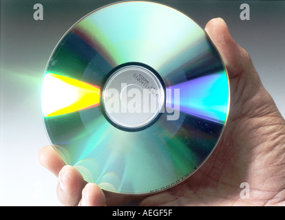 cd compact disc laser media hand holding Stock Photo