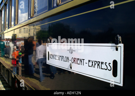 Orient express luxury train wagon carriage with crowd people reflected. Stock Photo