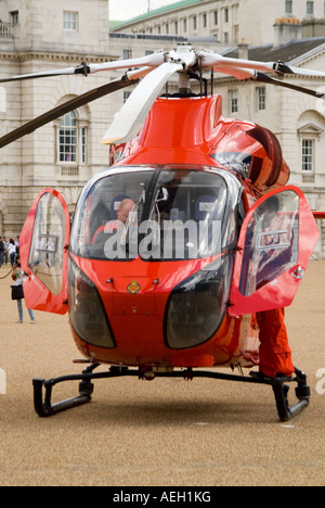 Vertical close up of the front of London's Air Ambulance with the pilots sitting in the cockpit Stock Photo