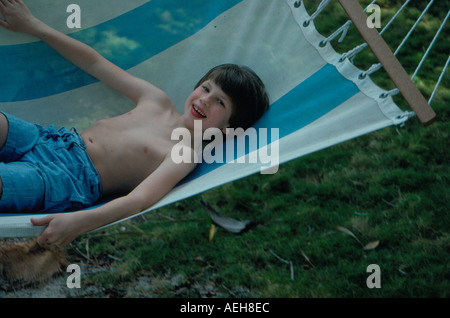 boy in hammock. Photo by Willy Matheisl Stock Photo