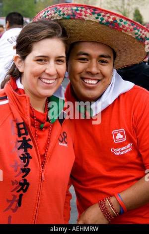 Two happy members of the State Farm Community Volunteer team parade unit. Cinco de Mayo Fiesta. "St Paul" Minnesota USA Stock Photo
