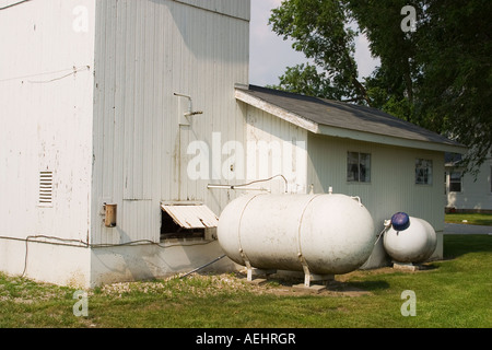 ILLINOIS Arcola Two propane tanks outside Amish family home used as alternative power source to electricity Stock Photo