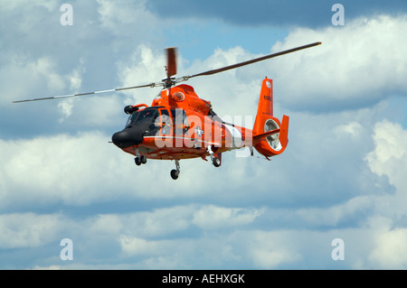 A US Coast Guard HH 65B SAR Helicopter demonstrates a search and rescue mission at Binghamton Airshow New York Stock Photo