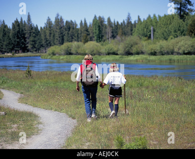 A family hikes along the Deschutes River Trail south of Bend Oregon Stock Photo