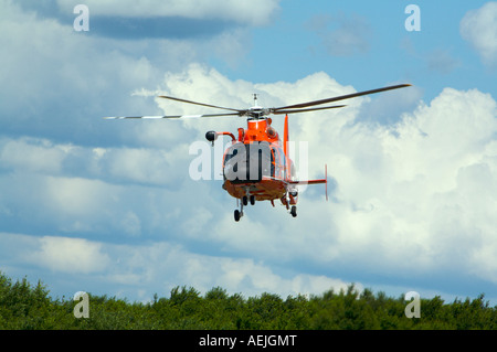 A US Coast Guard HH 65B SAR Helicopter demonstrates a search and rescue mission at Binghamton Airshow New York Stock Photo