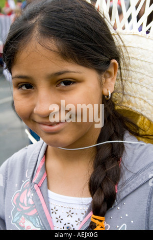 Happy young Chicana girl age 11 wearing Mexican sombrero. Cinco de Mayo Fiesta. 'St Paul' Minnesota USA Stock Photo