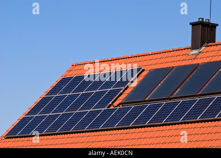 Solar plant on a tiled roof Stock Photo
