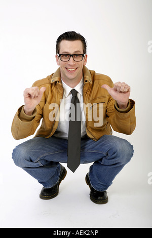 Portait of a young man, crouching Stock Photo