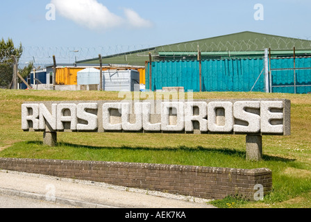 RNAS Culdrose sign and security fence outside Royal Navy airbase adjacent to HMS Seahawk at Culdrose Cornwall England UK Stock Photo