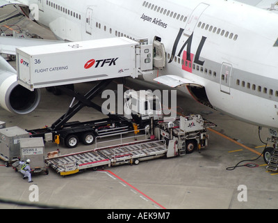 Cargo and catering being   loaded on a  747 aircraft of JAL. Norita airport  Tokyo Japan Stock Photo