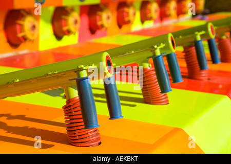 ILLINOIS Grayslake Neon colors at water gun shooting gallery handles and targets arcade booth at Lake County Fair Stock Photo