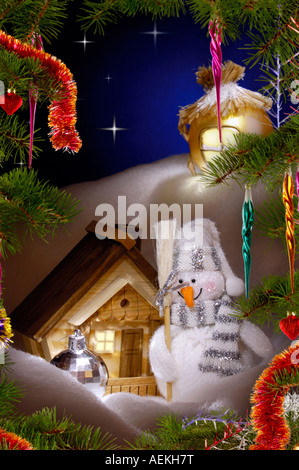 Artistic Holiday Christmas card Snowman and christmas decoration Stock Photo