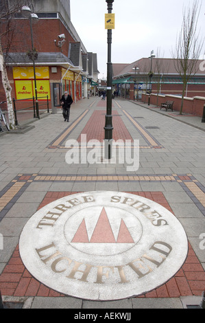 Shoppers walk around Lichfield town centre. Stock Photo