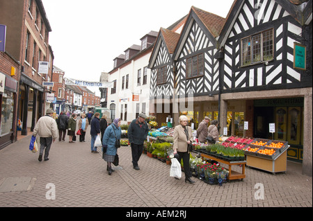 Shoppers walk around Lichfield town centre. Stock Photo