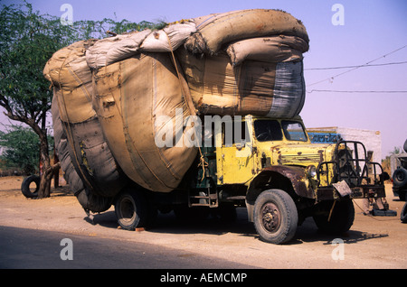 Severely overloaded lorry on the roadside near Bikaner in the Thar Desert.   No MOT necessary Stock Photo