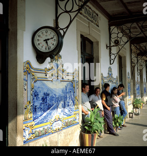 Waiting passengers at Pinhao railway station decorated with azulejos, Pinhao, Douro valley, Portugal, Europe, Stock Photo