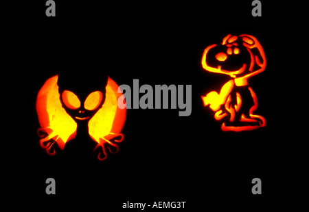 Freshly carved jack-o-lanterns at a family Halloween party in Utah, USA shine by candlelight in the dark. Stock Photo