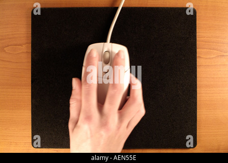 Close Up of a Woman Using a Computer Mouse Stock Photo