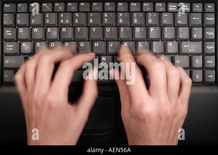 Typing on the keyboard of a Laptop Computer, Close Up. Stock Photo